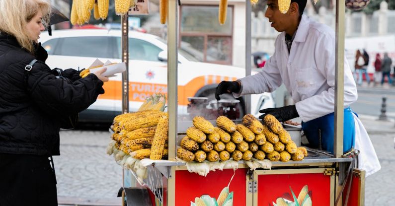 Impulse Buying - A woman selling corn on a street corner