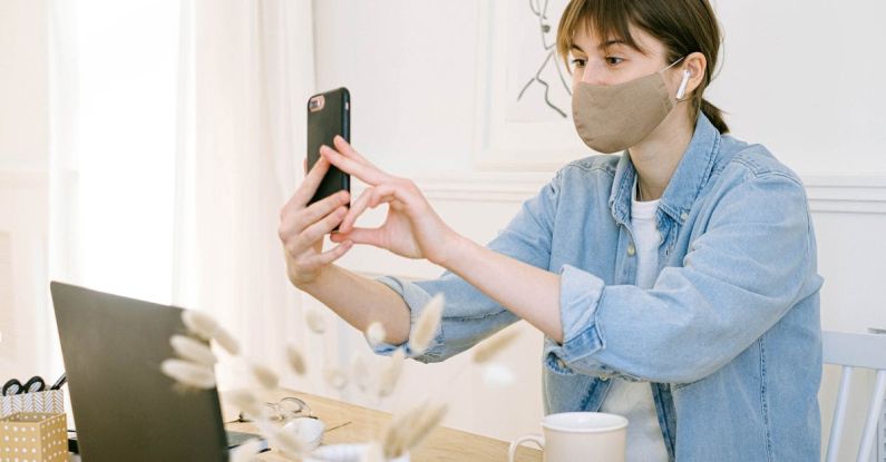 Face Masks - Woman in Face Mask Having Video Call